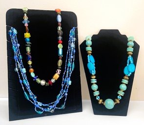 Three Bright And Colorful Necklaces Made From Glass And Other Materials