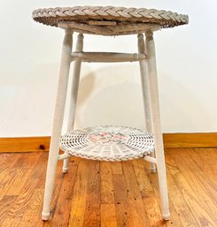 A Vintage Painted And Appliqud Wicker Occasional Table