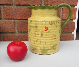 A Ruffled Rim Yellow Slip Glazed Redware Lemonade Pitcher