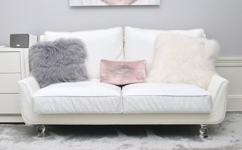 White Vegan Leather Low Love Seat With Lucite Turned Legs And Shearling Decorative Pillows