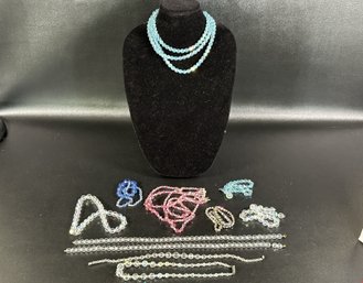 An Assortment Of Vintage Crystal Necklaces In Pink, Blue & Clear