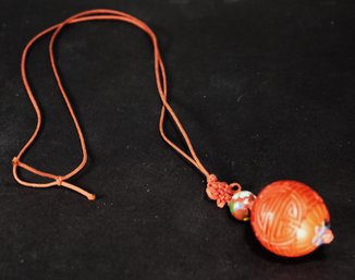 Silk Cord Chinese Necklace Having Large Carved Cinnabar Bead Pendant