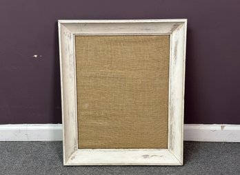 A Burlap Pinboard In A Rustic, Intentionally-Distressed Frame