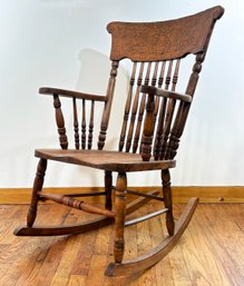 A Victorian Carved Oak Rocking Chair