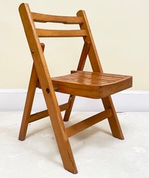 A Vintage Wood Child's Folding Chair