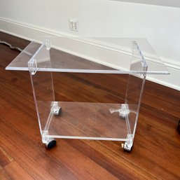 A Lucite Rolling Table