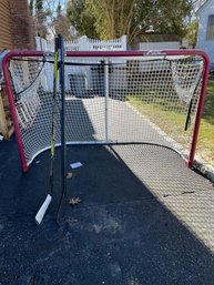 Hockey Net And 3 Sticks