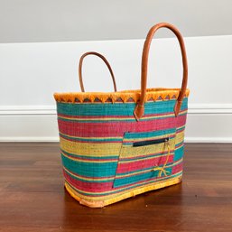 A Colorful Woven Beach Bag With Synch Closure Inside