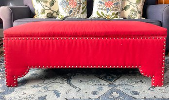 A Delightful Red Storage Ottoman/Coffee Table With Nailhead Trim