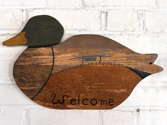 A Carved 'Welcome' Duck