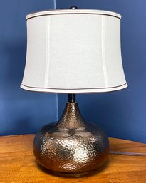 A Modern Hammered Silver Lamp