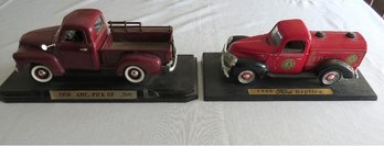 Two Scale Model Vintage Pickup Trucks On Stands