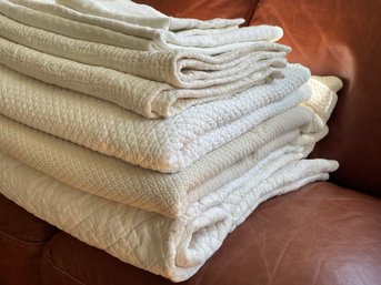 Large Assortment Of Mostly European White Bedding, Quilts, Pillow Shams.