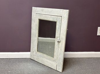 A Mirrored Door From A Vintage Medicine Chest