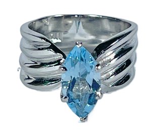 Fine Larger Sterling Silver Ladies Ring Having Marquis Blue Topaz Stone