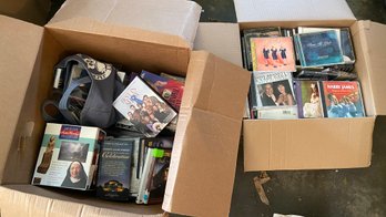 Two Boxes Of DVD's And CD's