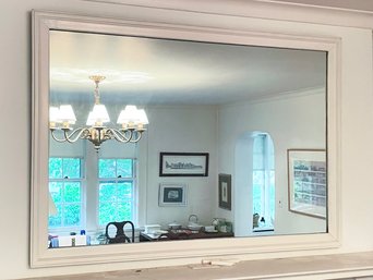 A Large Painted Wood Framed Mirror