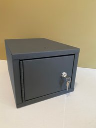 A Grey Documents Safe With Key