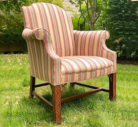 An Elegant Traditional Rolled Arm Chair