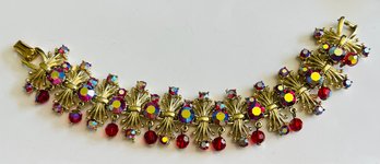 BEST SIGNED CORO GOLD TONE RED AURORA RHINESTONE DANGLE BRACELET