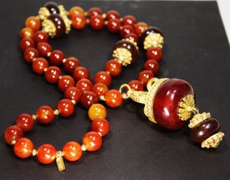 Large Kenneth J Lane Bakelite Beads Having Gold Tone Accents