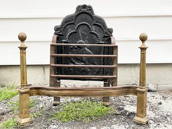 An Antique Brass And Cast Iron Fireplace Grille