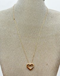 A 14K Gold Necklace In Heart Form With Rhinestone Details