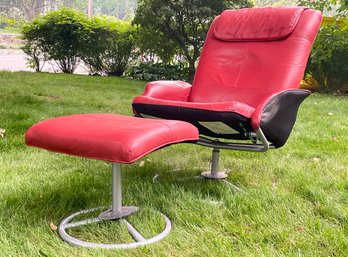 A Vintage Scandinavian Modern Leather Arm Chair And Footstool