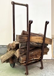 A Cast Iron Wood Holder And Firewood!