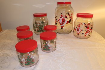 -Assorted Christmas Themed Jars With Red Lids  Unused.  1 Large Is 10.5 Tall, 2 Medium: 7 Tall, 5 Small: 3