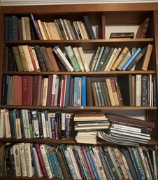 FIVE SHELVES OF BOOKS ON SPORTS AND THE OUTDOORS