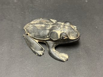 A Vintage Cast-Metal Frog With A Hinged Lid