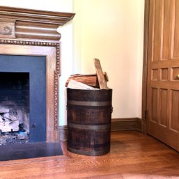 An Antique Wood Barrel With Brass Staves