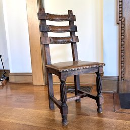 A Spanish Colonial Leather And Nail Head Trim Ladder Back Chair