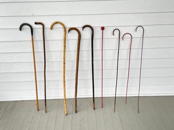 Assortment Of Walking Sticks Including Some Carnival Canes