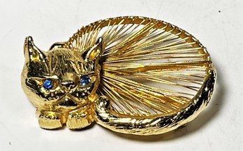 Vintage Gold Tone Monet Cat Brooch Having Rhinestone Blue Eyes