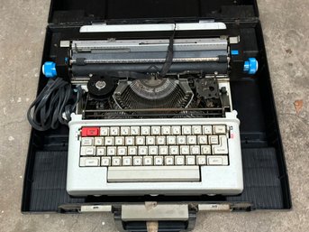 A Vintage Typewriter In Original Case