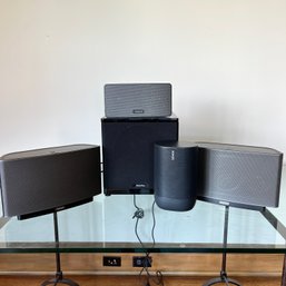 A Set Of Sonos Speakers And A Definitive Technology Subwoofer