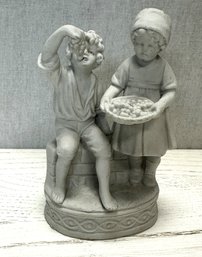 A Classic Boy & Girl Ceramic Figurine