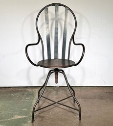 A Vintage Industrial Metal Shop Stool