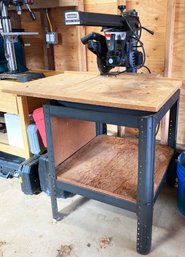 A Craftsman 9' Radial Arm Saw And Table