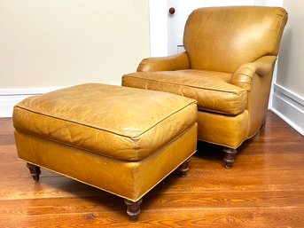 An Elegant Leather Armchair And Ottoman By Stickley