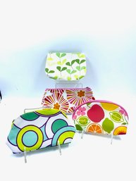 Grouping Of Brightly Colored Cosmetics Bags By Clinique
