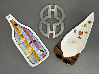 A Pair Of Whimsical Ceramic Spoon Rests & A Stainless Trivet