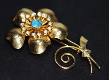 Large Vintage Gold Tone Flower Brooch Having Blue Stone