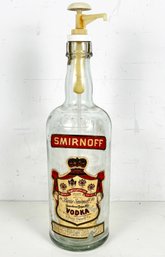 A Vintage Smirnoff Vodka Bottle With Pump Top