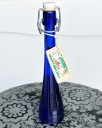 A Vintage Cobalt Glass Grappa Bottle