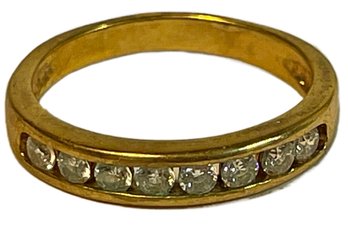 Gold Tone Ladies Ring Having Channel Set White Stones Size 5