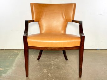 An Art Deco Armchair In Orange Leather