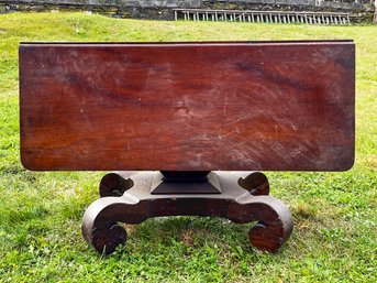 A 19th Century Mahogany Pedestal Base Drop Leaf Table